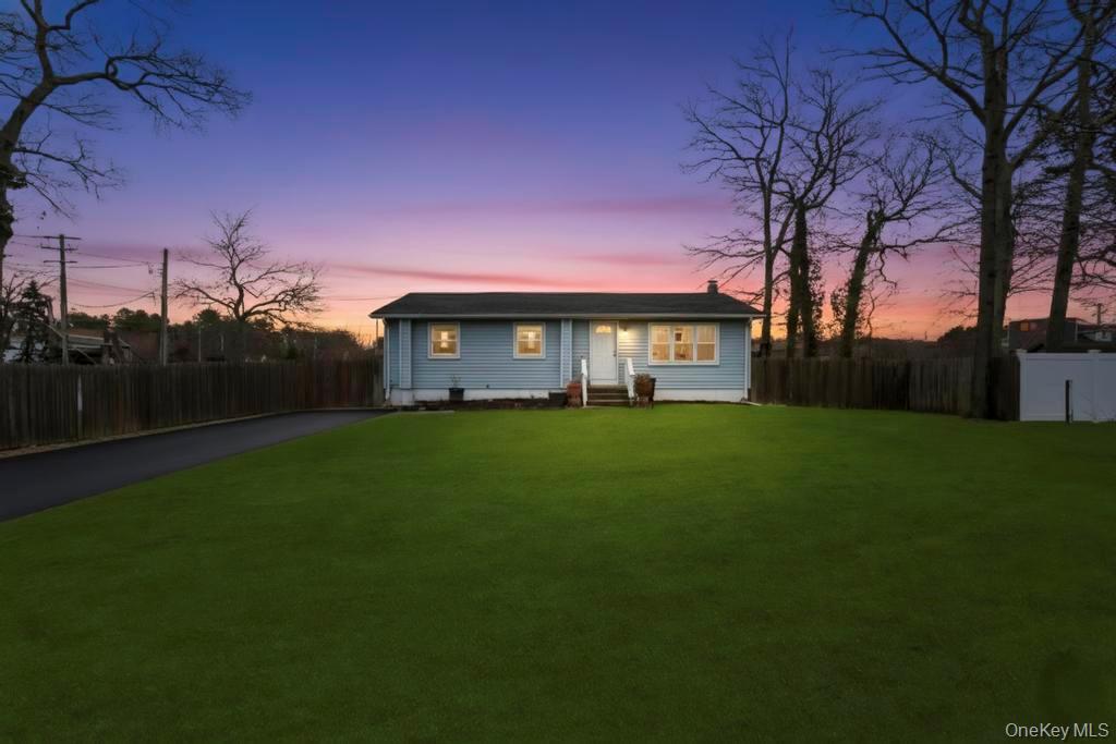 19 Windus Road Shirley, NY 11967 - Photo 1 of 29 a front view of a house with a garden