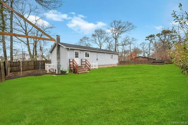 a view of a backyard with a garden and plants
