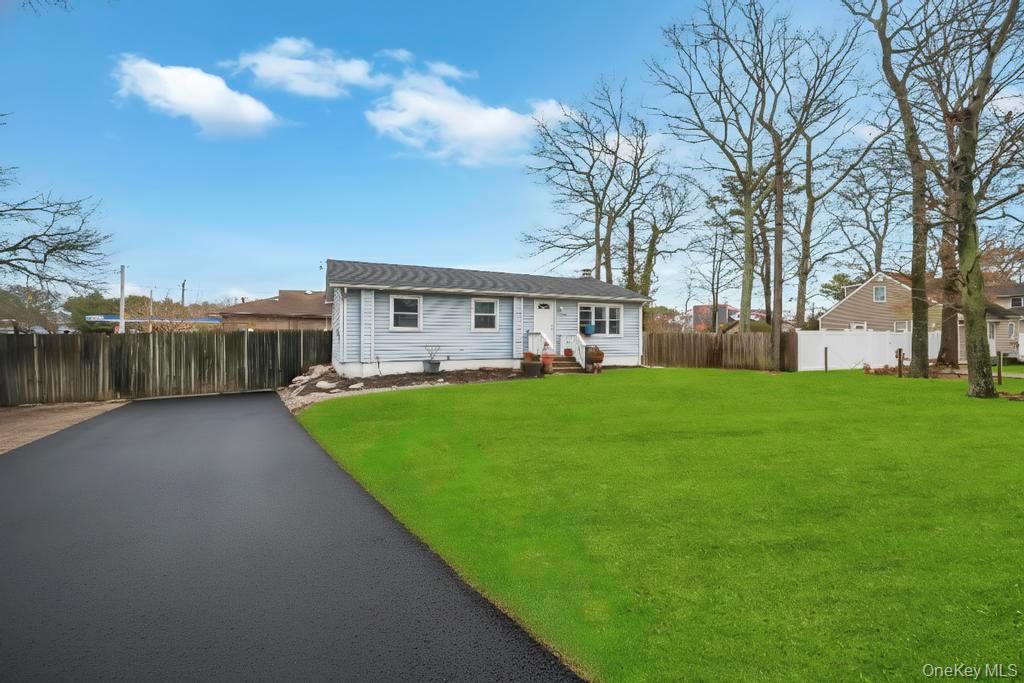 19 Windus Road Shirley, NY 11967 - Photo 3 of 29 a view of house with backyard
