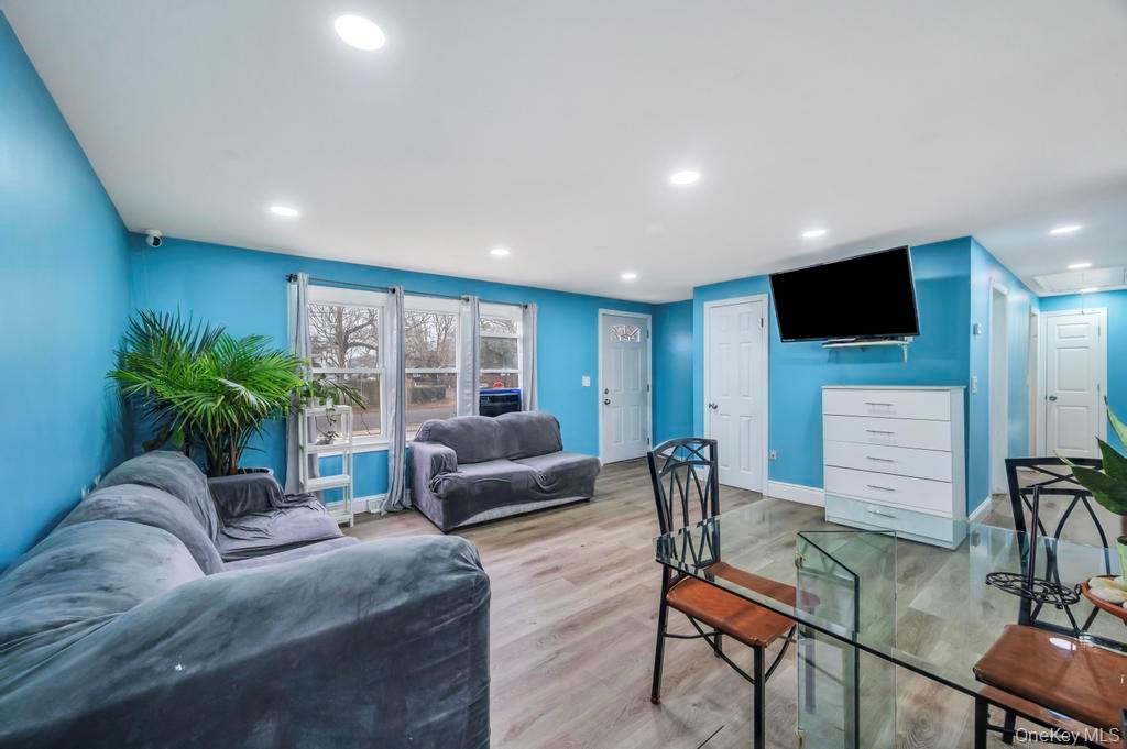 19 Windus Road Shirley, NY 11967 - Photo 7 of 29 a living room with furniture and a flat screen tv