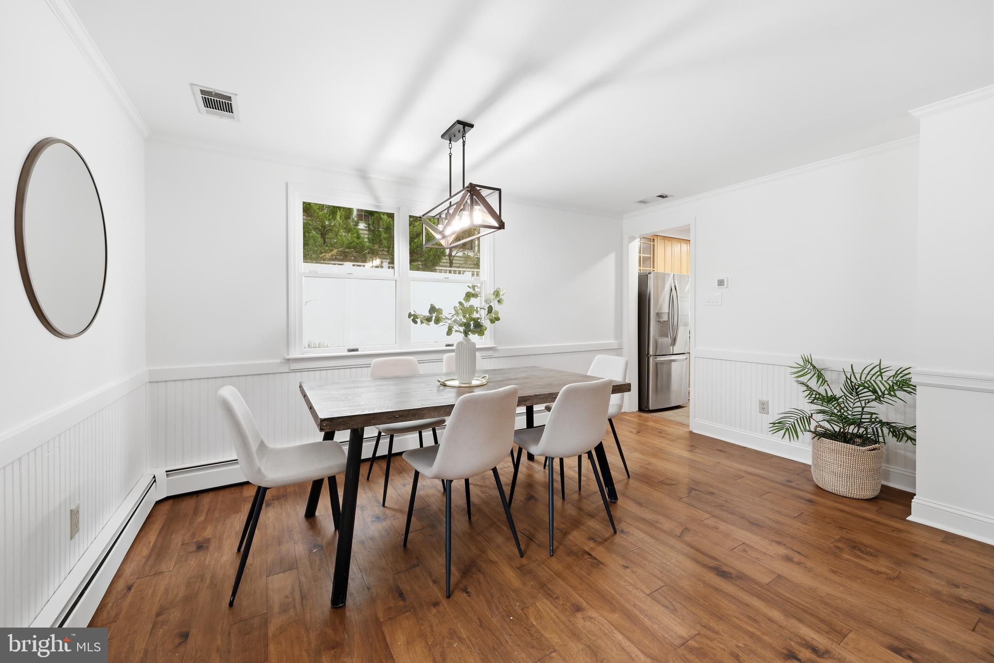 404 Centre Street Haddonfield, NJ 08033 - Photo 12 of 38 a view of a dining room with furniture and wooden floor