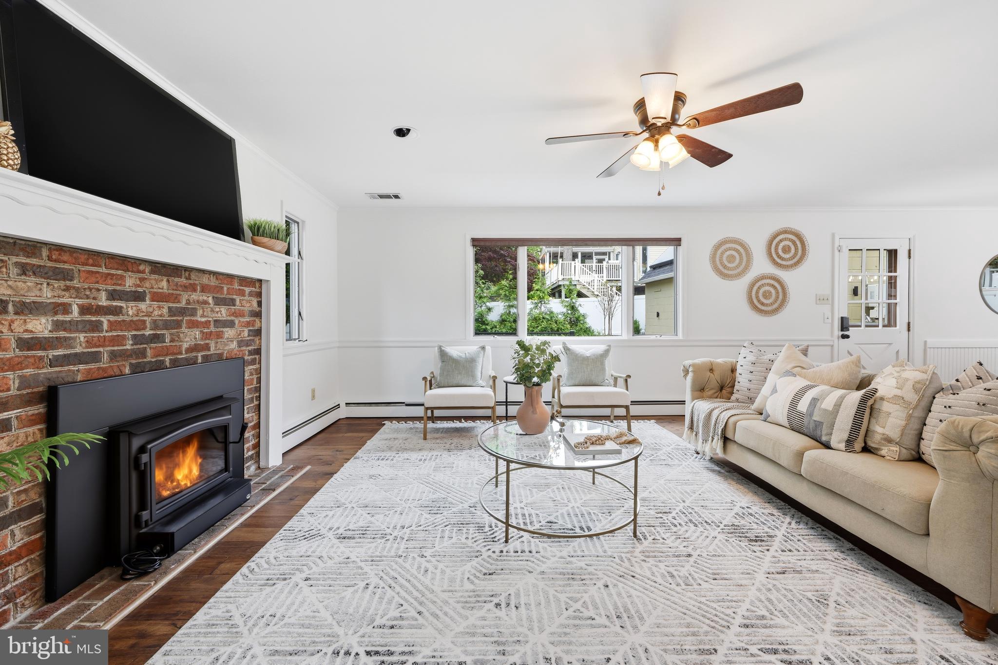 404 Centre Street Haddonfield, NJ 08033 - Photo 14 of 38 a living room with furniture and a fireplace