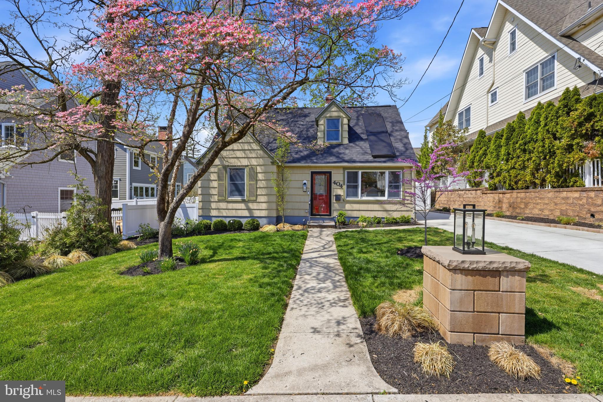 404 Centre Street Haddonfield, NJ 08033 - Photo 2 of 38 a front view of a house with a yard