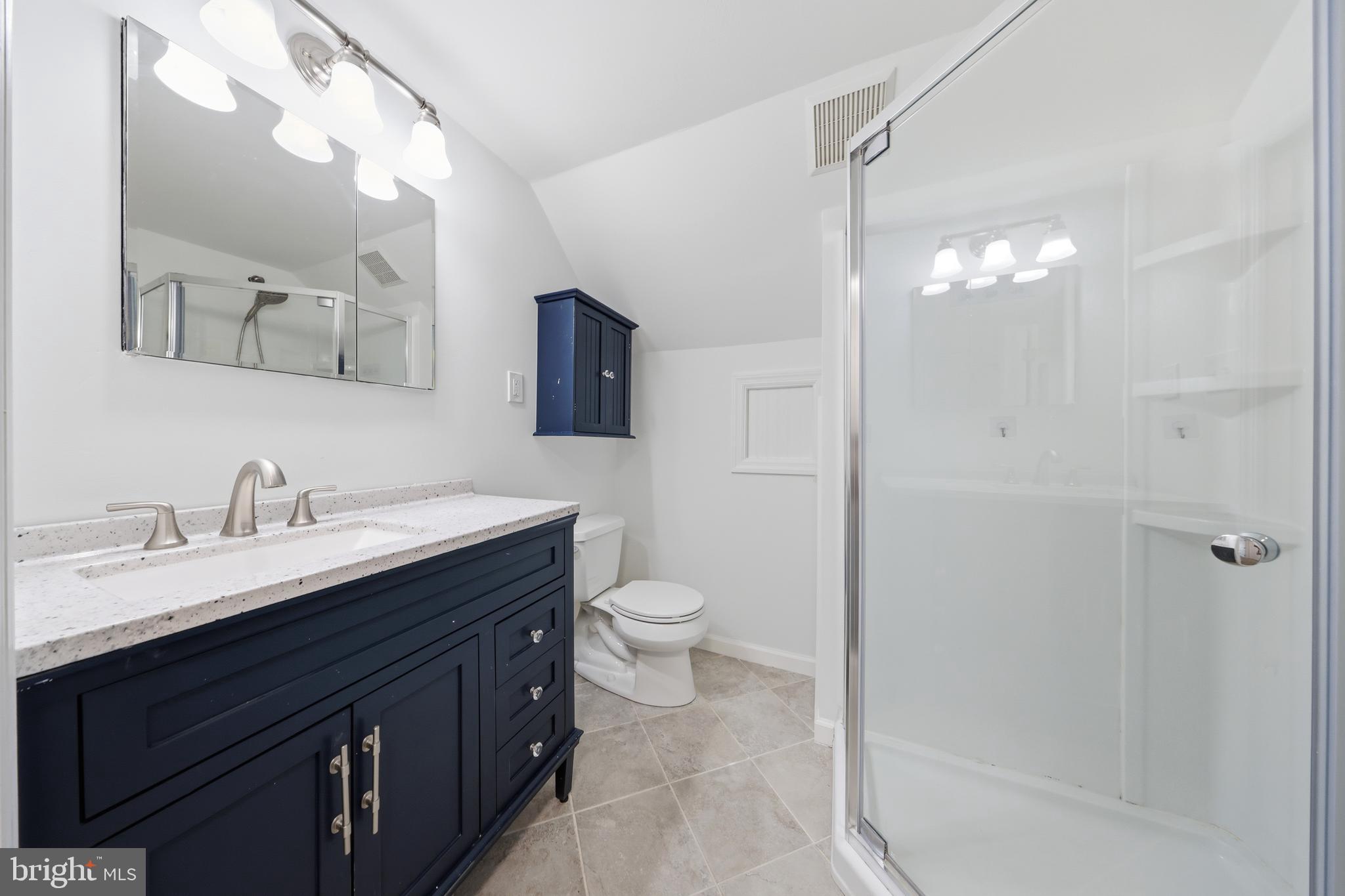 404 Centre Street Haddonfield, NJ 08033 - Photo 24 of 38 a bathroom with a granite countertop sink toilet and shower