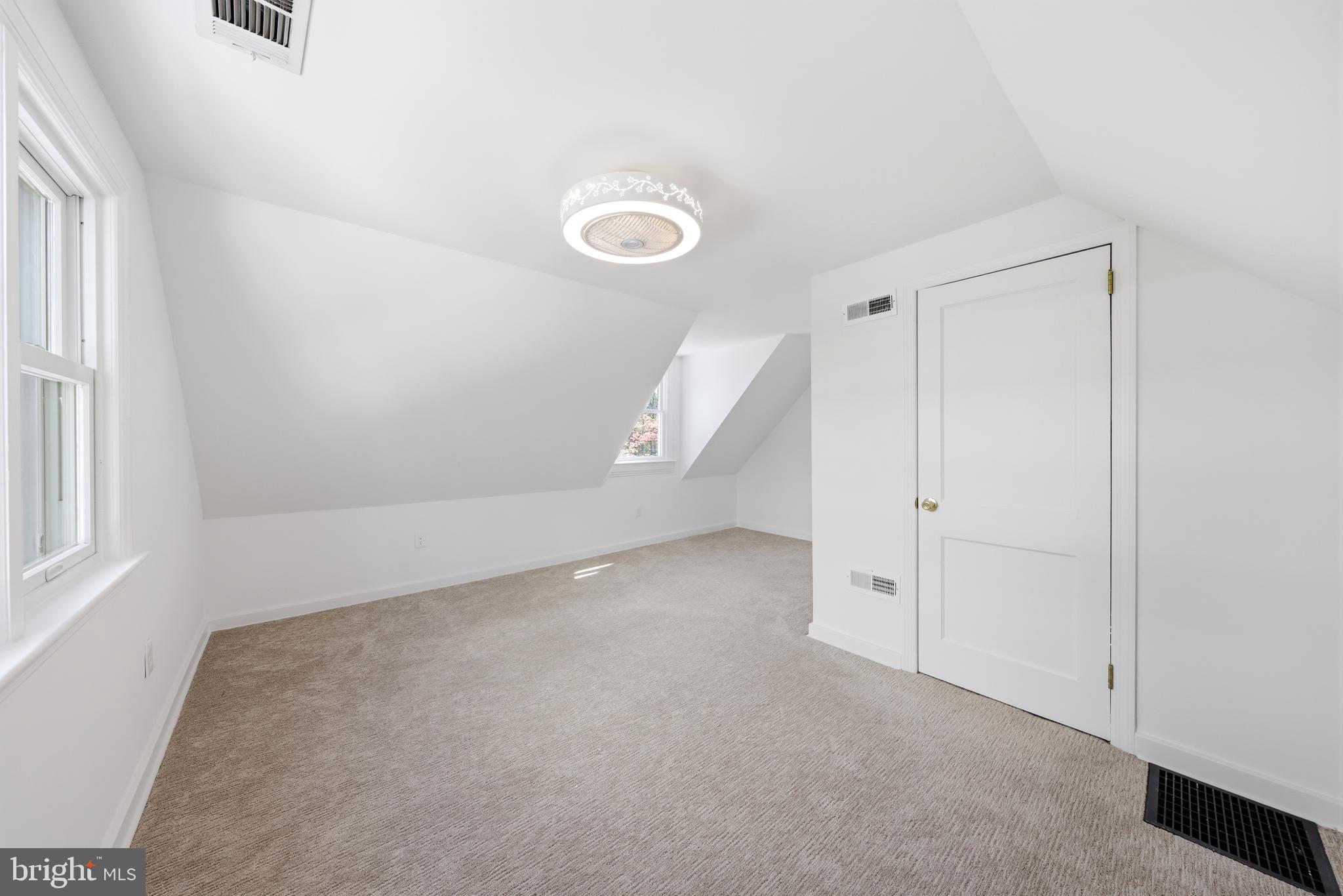 404 Centre Street Haddonfield, NJ 08033 - Photo 27 of 38 an empty room with a fan and a window