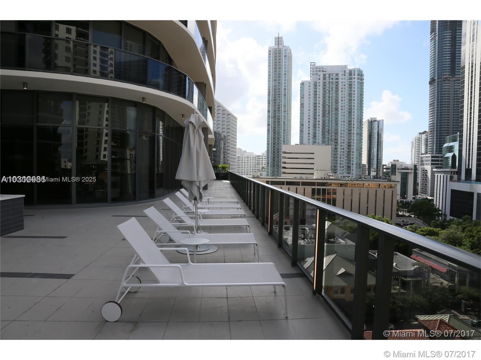 55 Southwest 9th Street, Unit 3409 Miami, FL 33130 - Photo 19 of 28 a view of a balcony with chairs