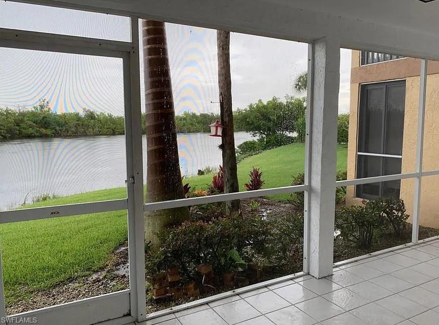 1305 Mainsail Drive, Unit 1002 Naples, FL 34114 - Photo 2 of 10 a view of a garden from a window