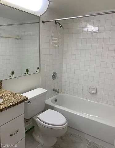 a bathroom with a sink a toilet and a bathtub