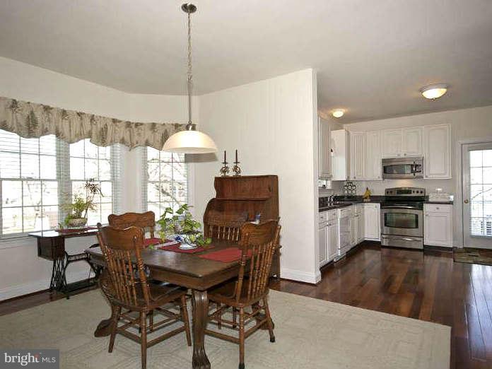 9118 Cuckold Point Road Baltimore, MD 21219 - Photo 14 of 27 a dining room with furniture and window