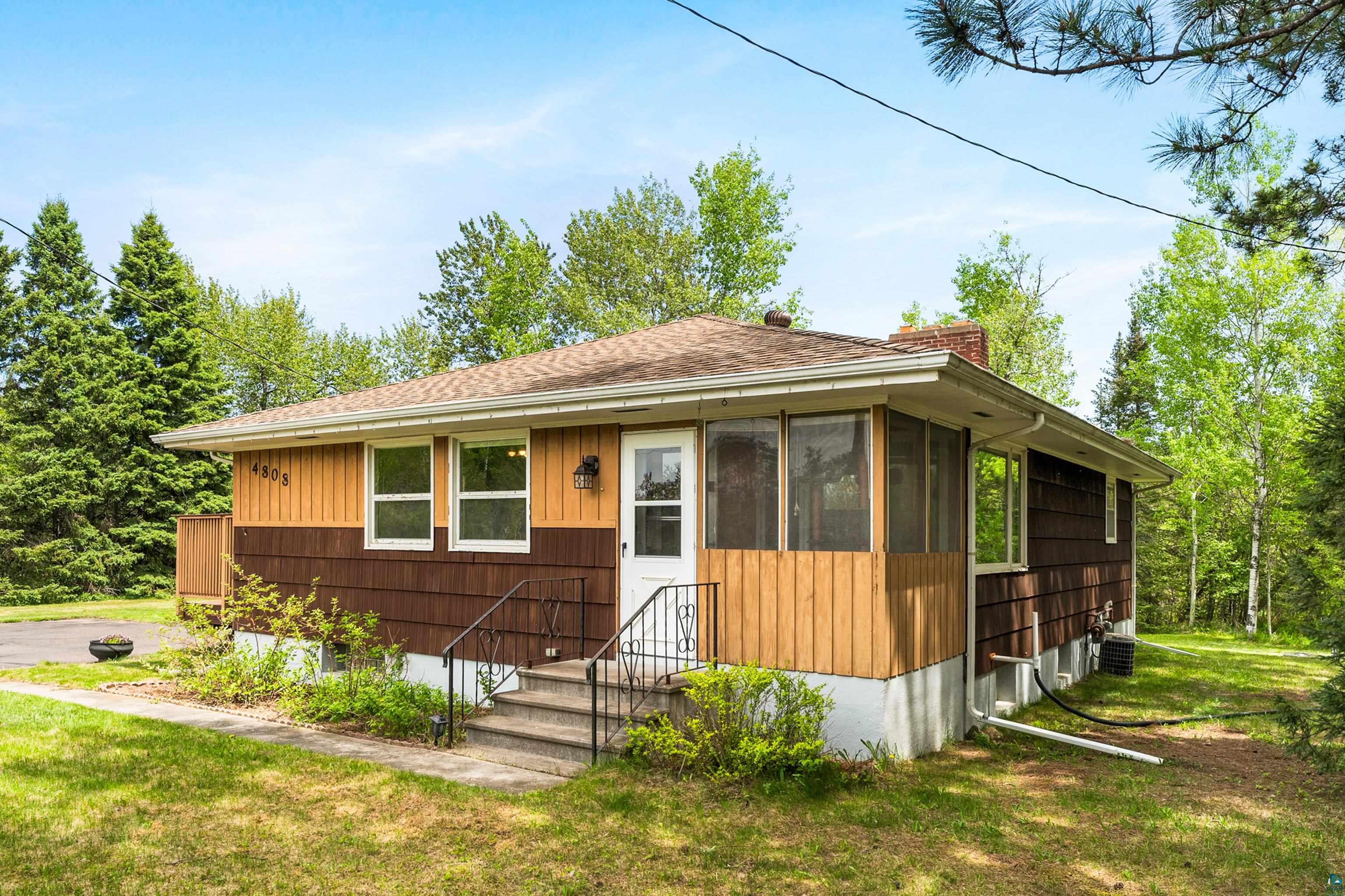 4808 Midway Road Duluth, MN 55811 - Photo 5 of 57 Single-story residence featuring a combination of brown siding and light wood-finish vertical paneling