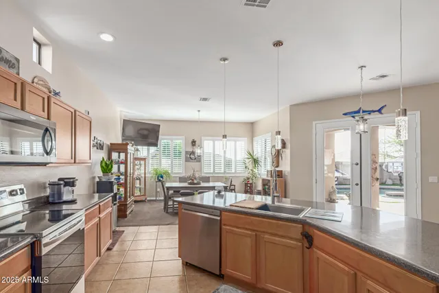 a view of a dining room with furniture window and outside view