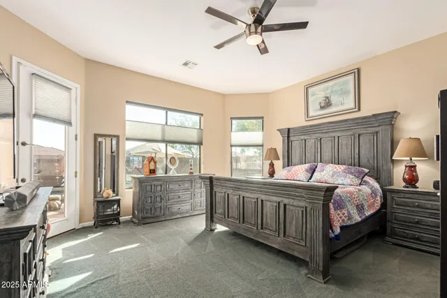 a bedroom with a bed and cabinets