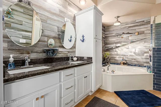 a bathroom with a bathtub and shower