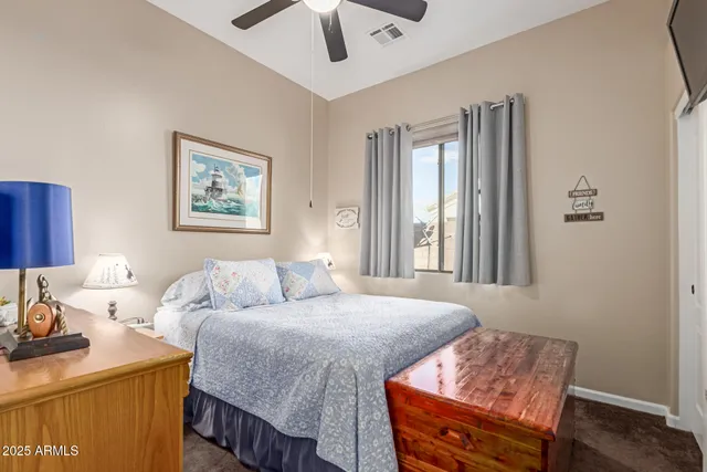 a bathroom with a sink toilet double vanity and shower