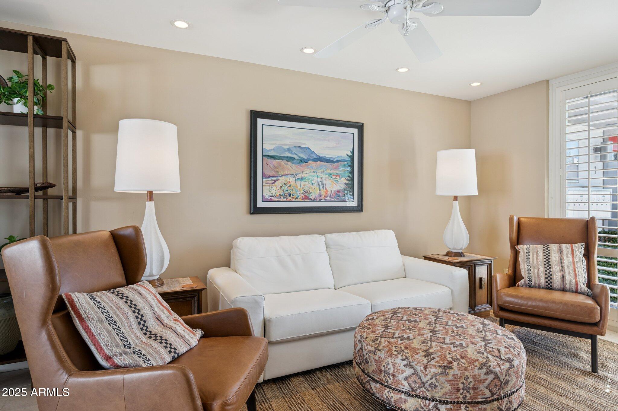 4208 North 38th Street, Unit 2 Phoenix, AZ 85018 - Photo 1 of 20 a living room with furniture and a lamp