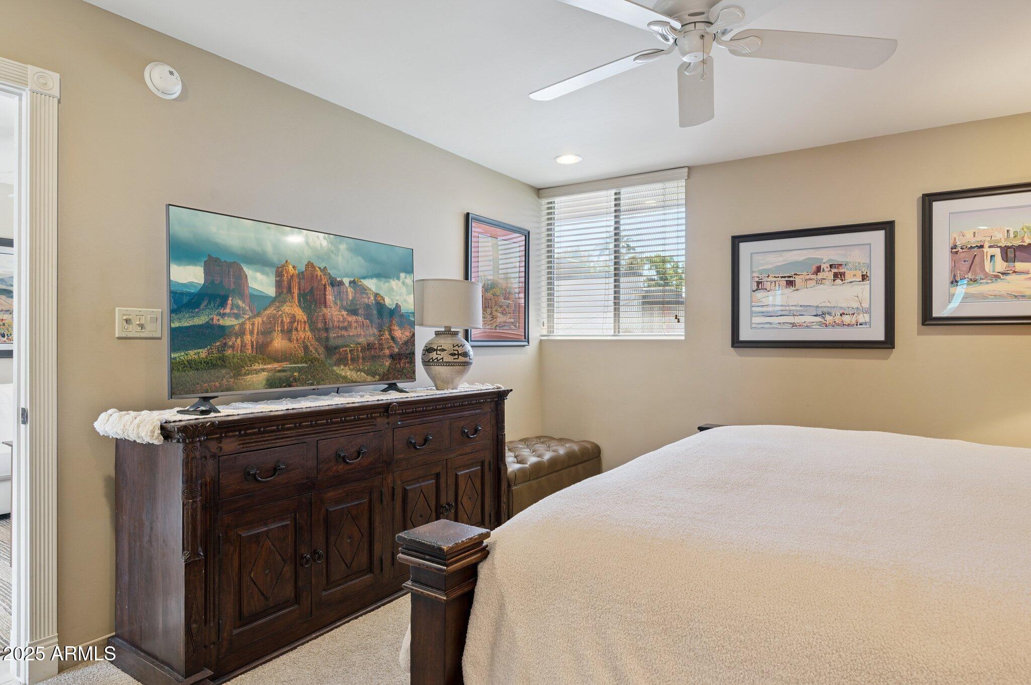 4208 North 38th Street, Unit 2 Phoenix, AZ 85018 - Photo 12 of 20 a bedroom with a bed and a dresser