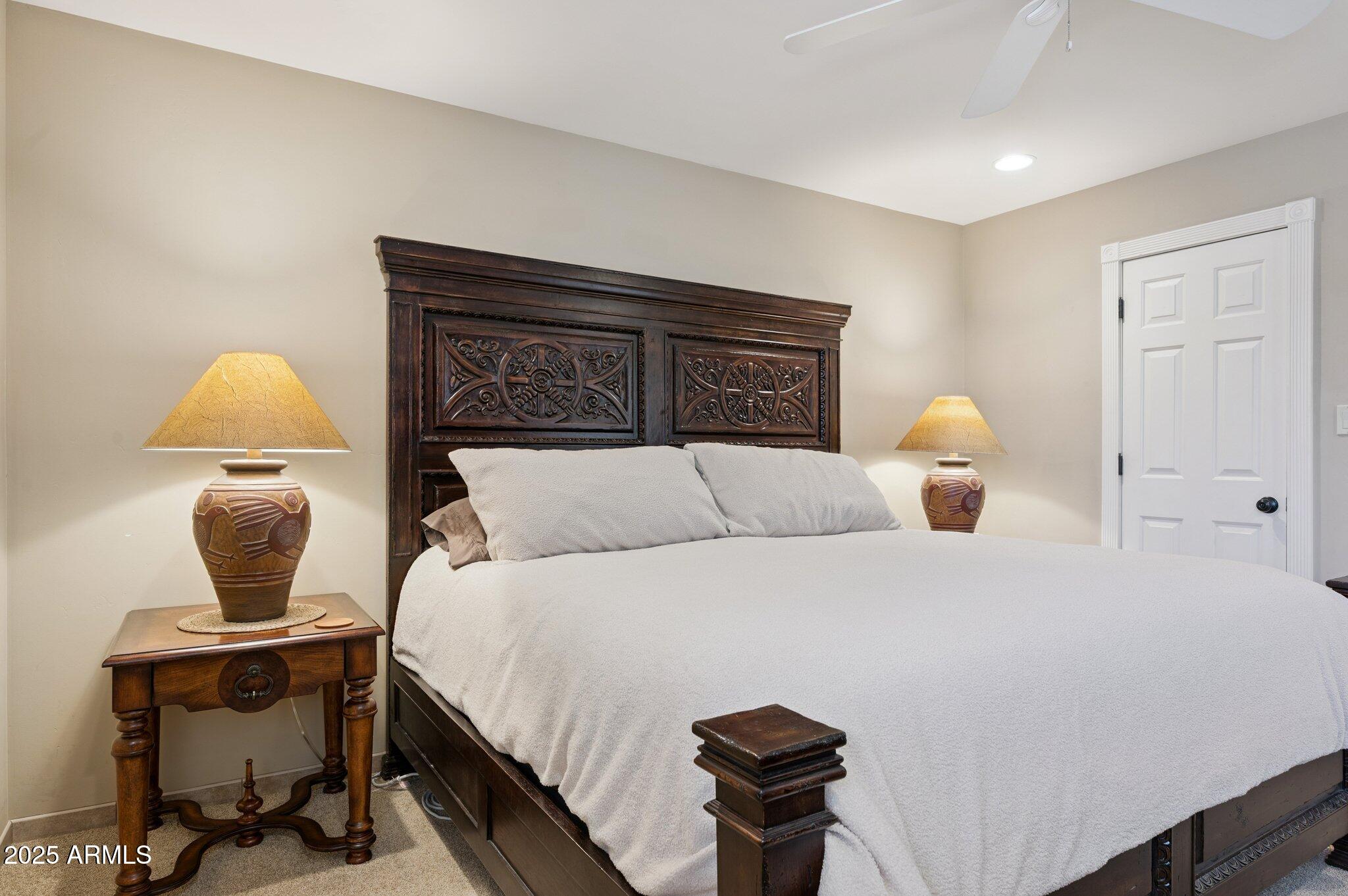 4208 North 38th Street, Unit 2 Phoenix, AZ 85018 - Photo 13 of 20 a bedroom with a bed and a potted plant