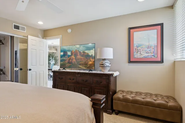 a bedroom with a bed and a dresser