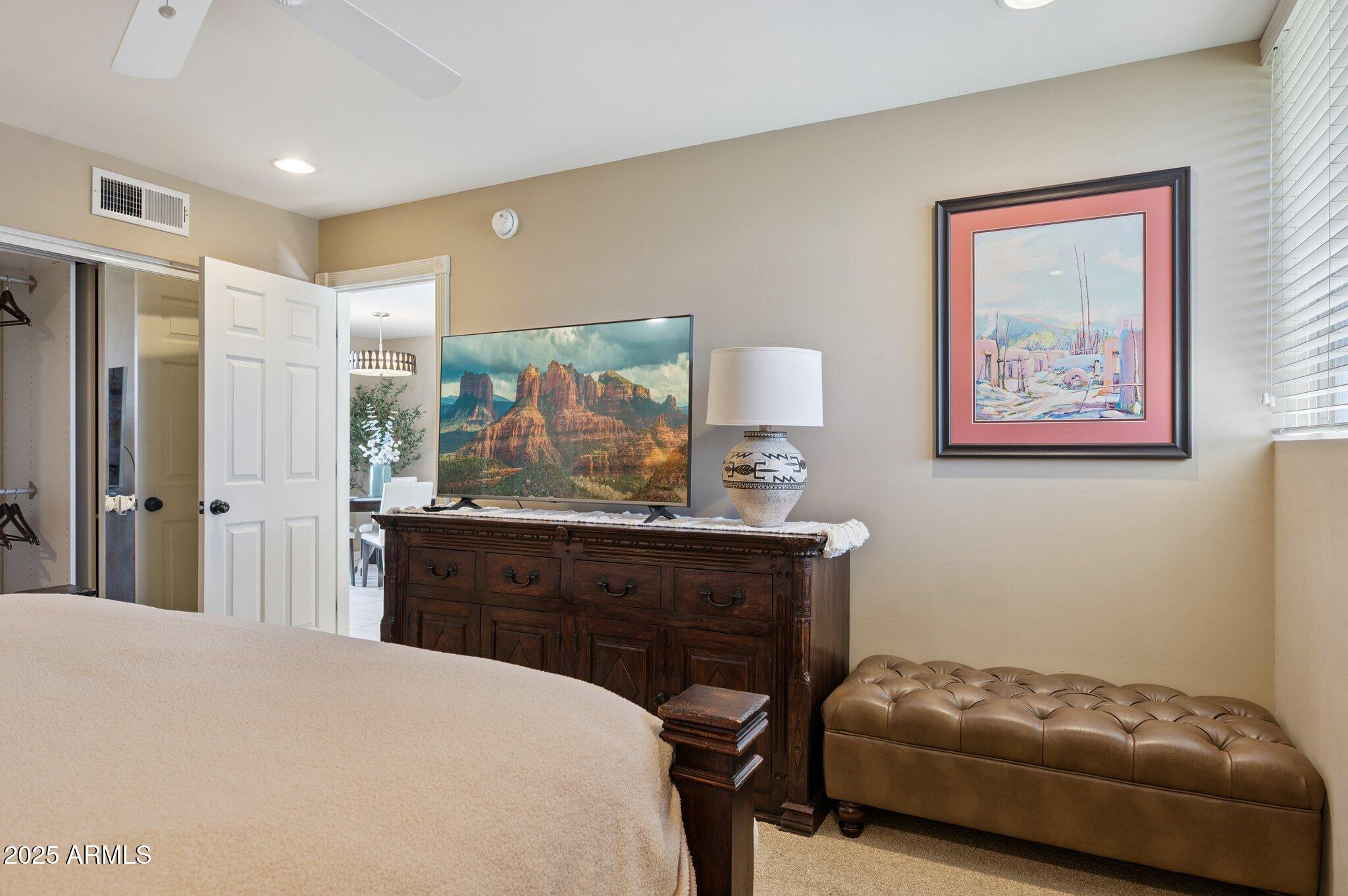 4208 North 38th Street, Unit 2 Phoenix, AZ 85018 - Photo 14 of 20 a bedroom with a bed and a dresser