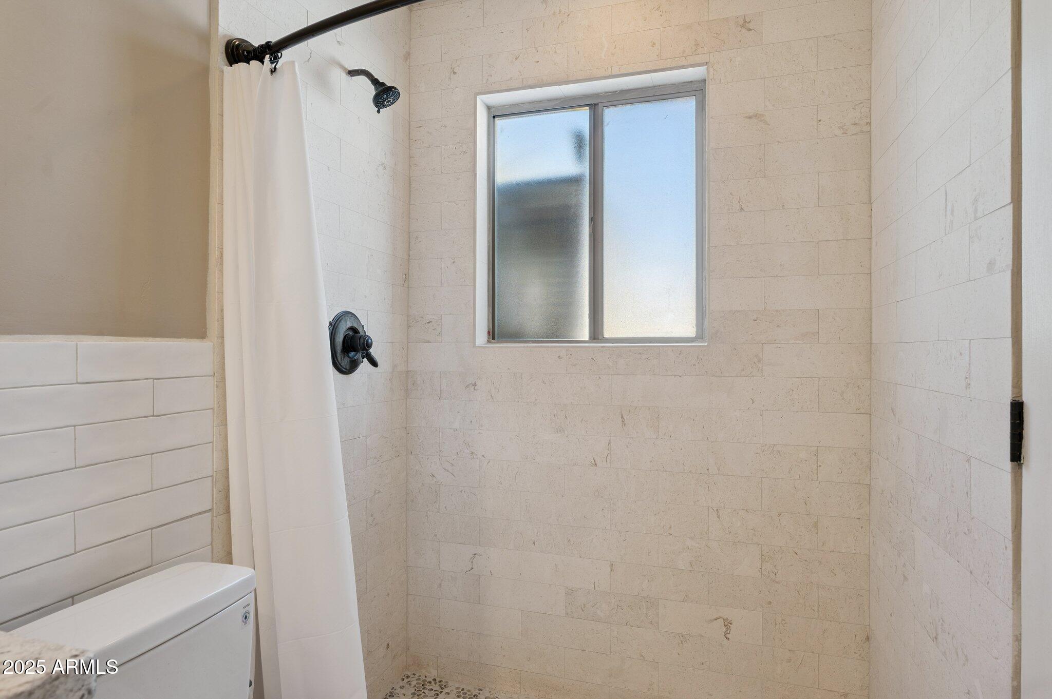 4208 North 38th Street, Unit 2 Phoenix, AZ 85018 - Photo 16 of 20 a bathroom with a shower