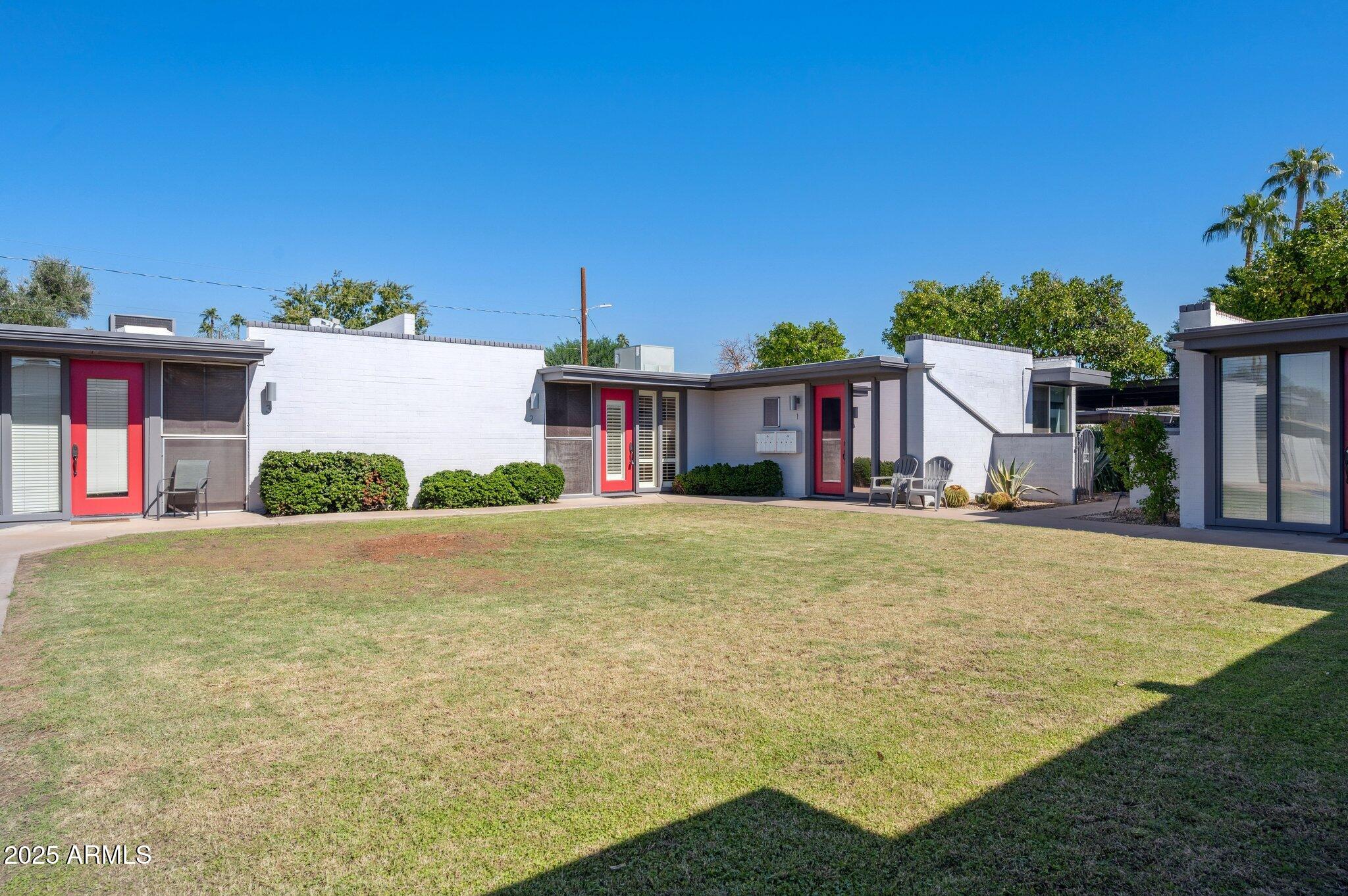 4208 North 38th Street, Unit 2 Phoenix, AZ 85018 - Photo 20 of 20 a front view of a house with yard