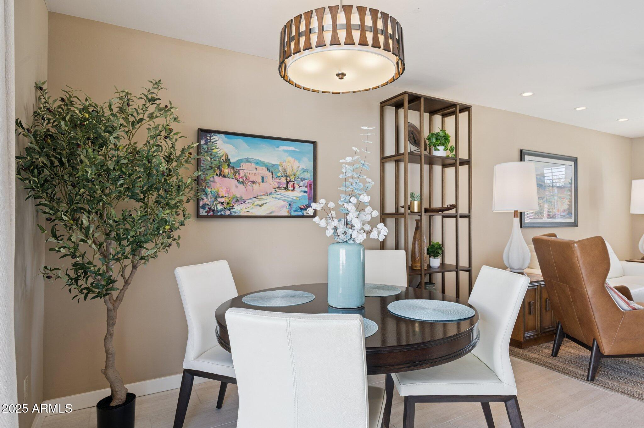 4208 North 38th Street, Unit 2 Phoenix, AZ 85018 - Photo 4 of 20 a view of a dining room with furniture and wooden floor
