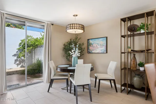 a view of a livingroom with furniture and a potted plant