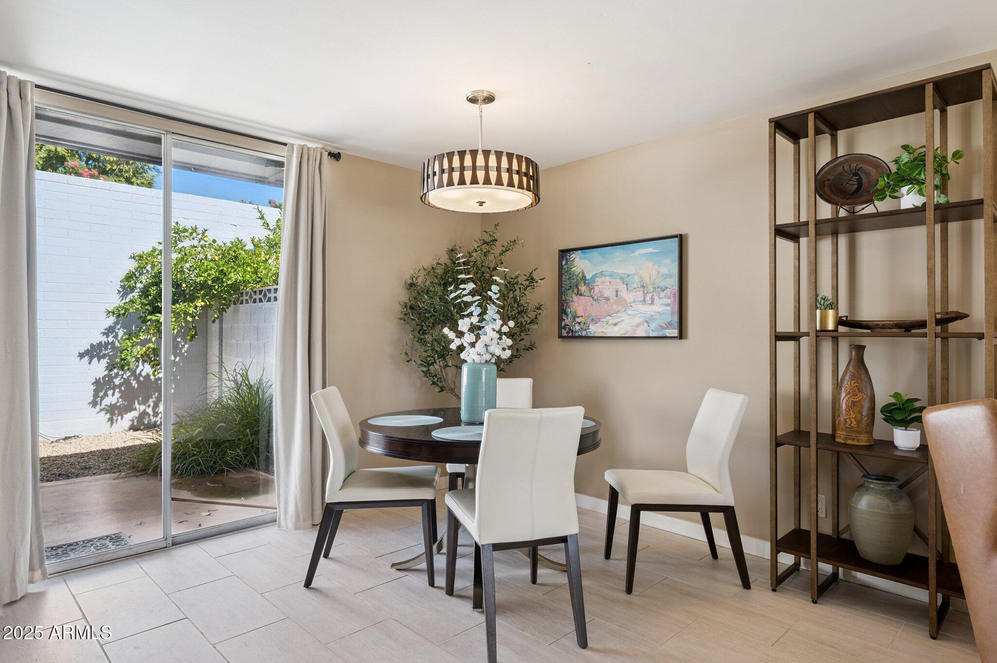 4208 North 38th Street, Unit 2 Phoenix, AZ 85018 - Photo 5 of 20 a view of a livingroom with furniture and a potted plant