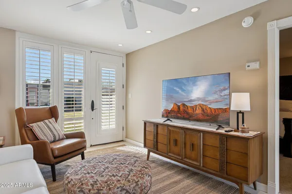 a bedroom with furniture and a window