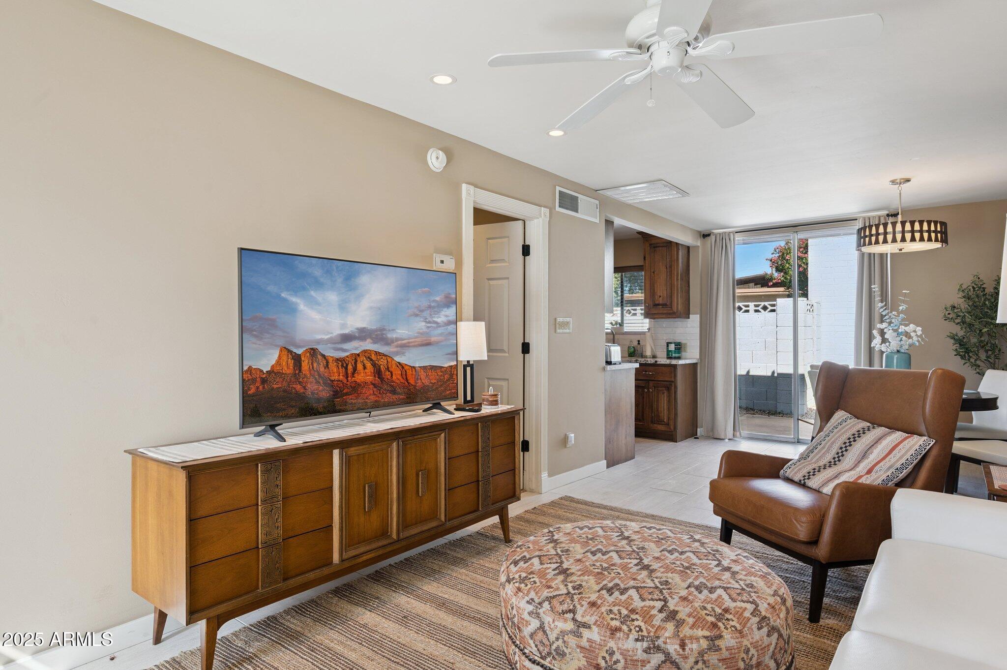 4208 North 38th Street, Unit 2 Phoenix, AZ 85018 - Photo 7 of 20 a living room with furniture and a rug