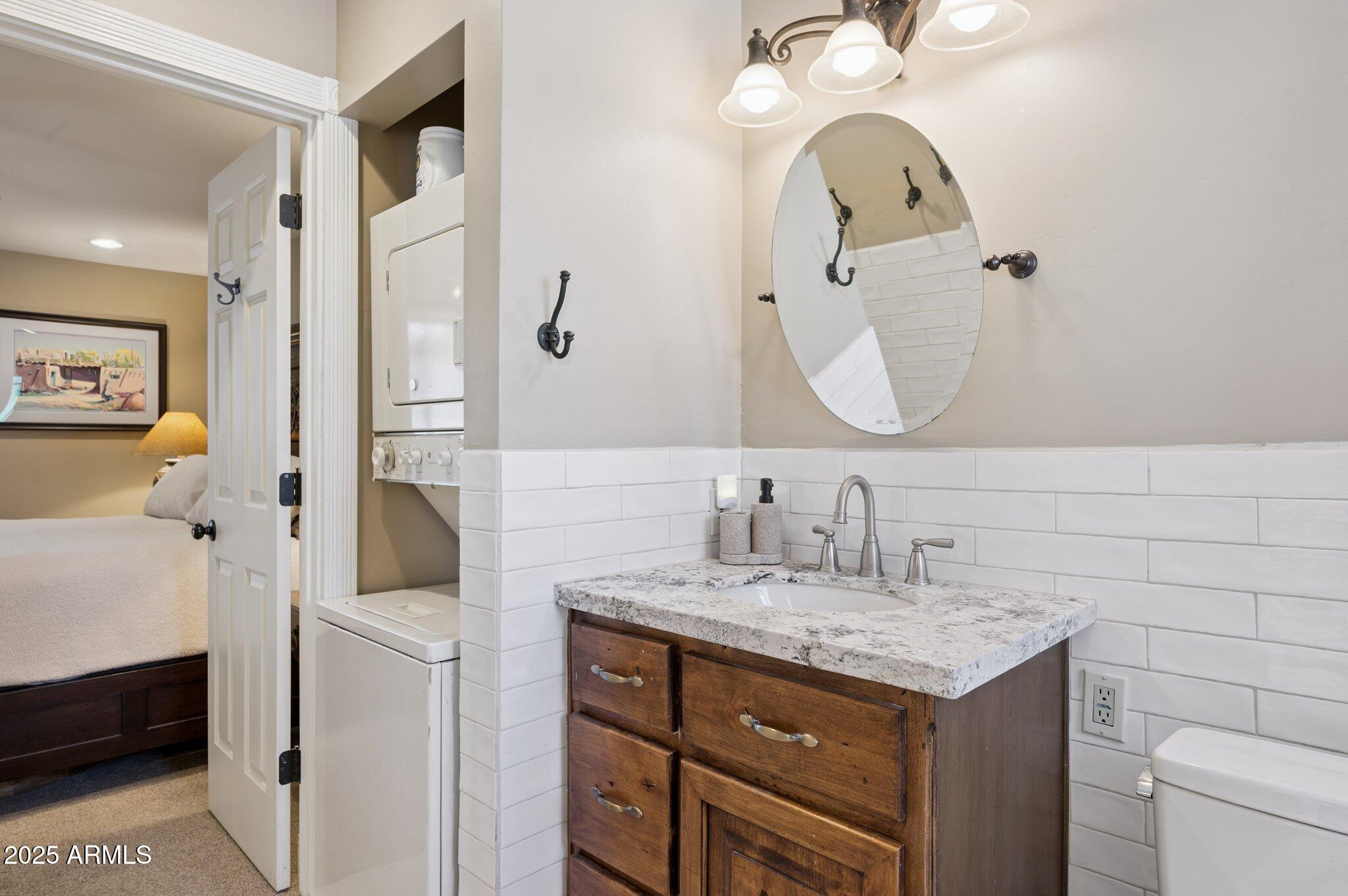 4208 North 38th Street, Unit 2 Phoenix, AZ 85018 - Photo 10 of 20 a bathroom with a sink and a mirror
