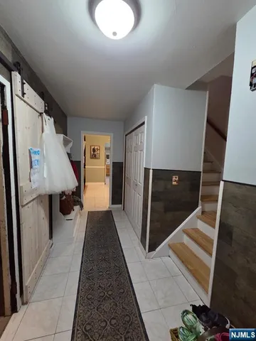 a hallway with seating area