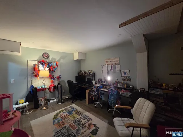 a room with furniture and a flat screen tv