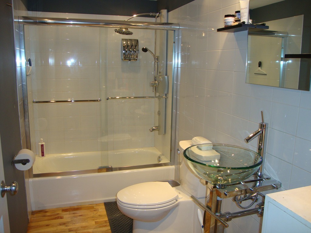 210 Broadway, Unit 104 Everett, MA 02149 - Photo 10 of 13 a bathroom with a sink toilet and shower