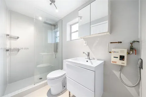 a bathroom with a toilet and shower