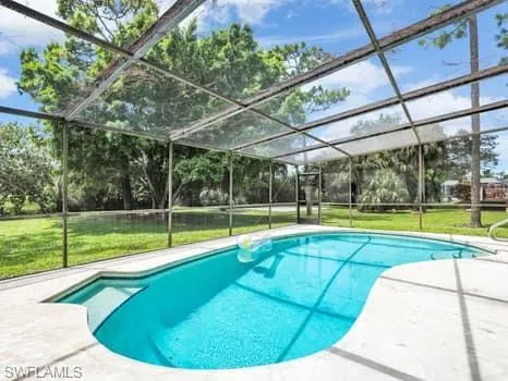 a view of a swimming pool with a backyard
