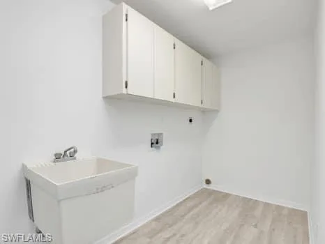 a view of utility room with two washing machine