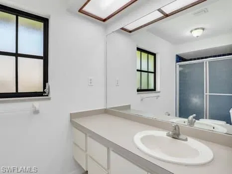 a bathroom with a sink and a mirror