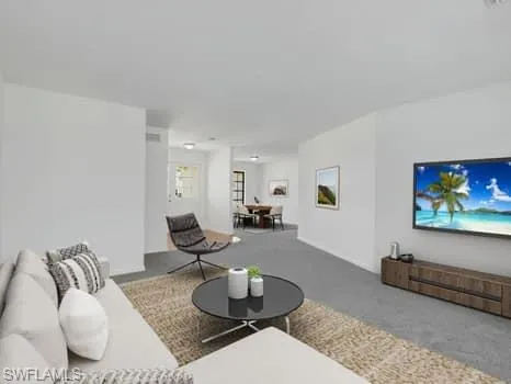 a large kitchen with stainless steel appliances granite countertop a stove a sink a refrigerator a center island and furniture