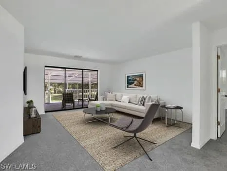 a living room with furniture and a couch