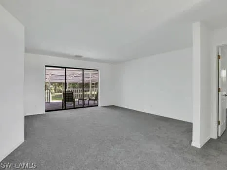 a view of an empty room with windows