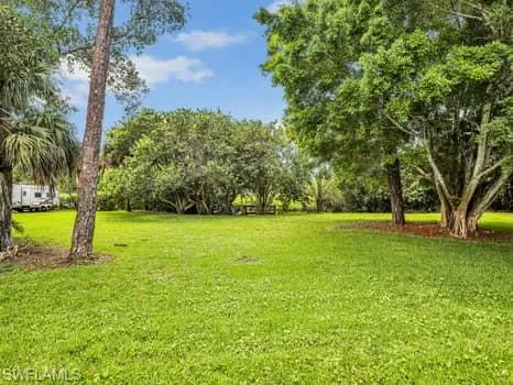 a view of room with furniture and a window