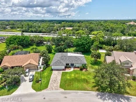 an aerial view of a house with a garden