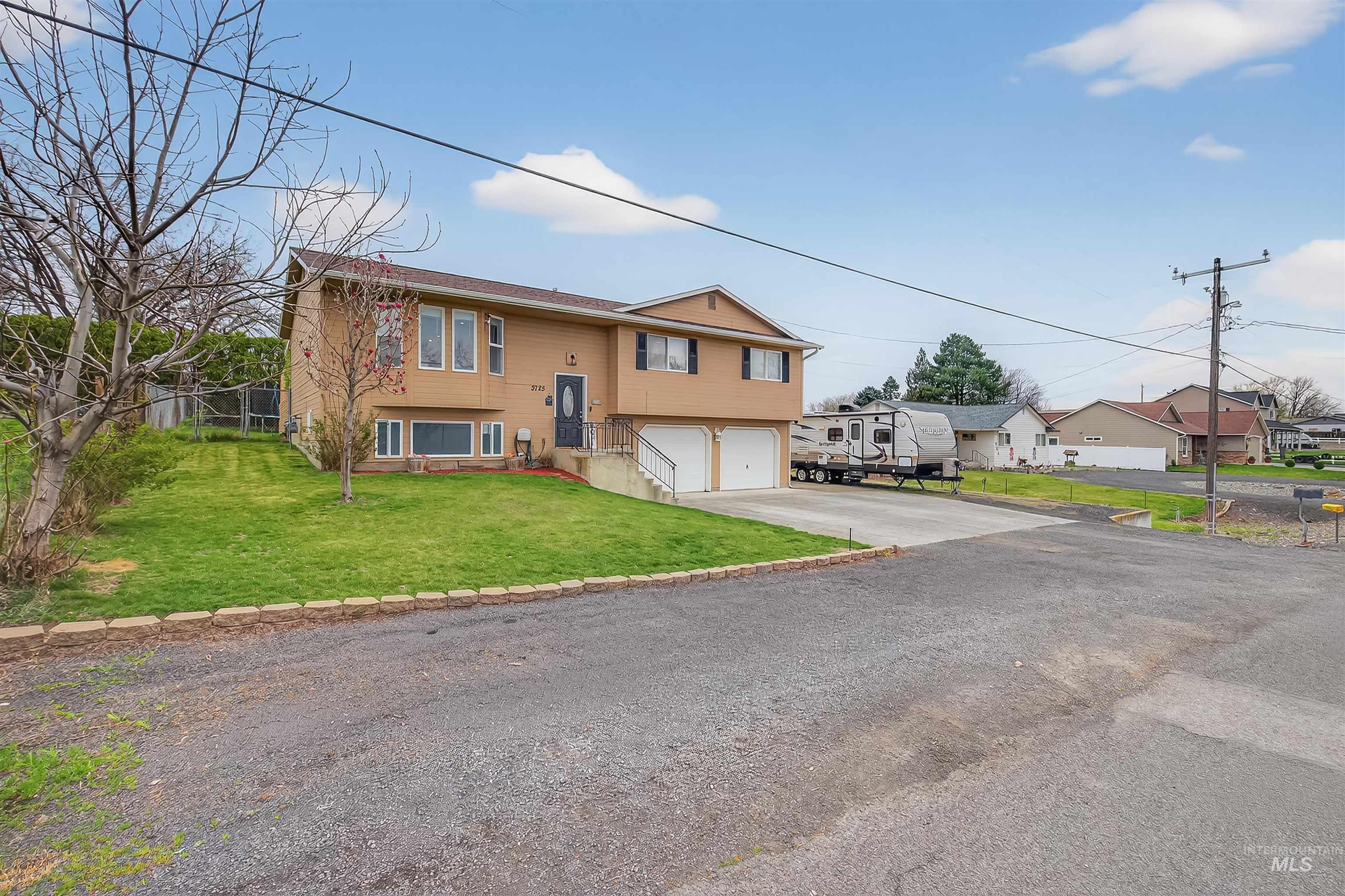 3725 11th Street Lewiston, ID 83501 - Photo 1 of 46 Split foyer home with a garage, driveway, and a residential view
