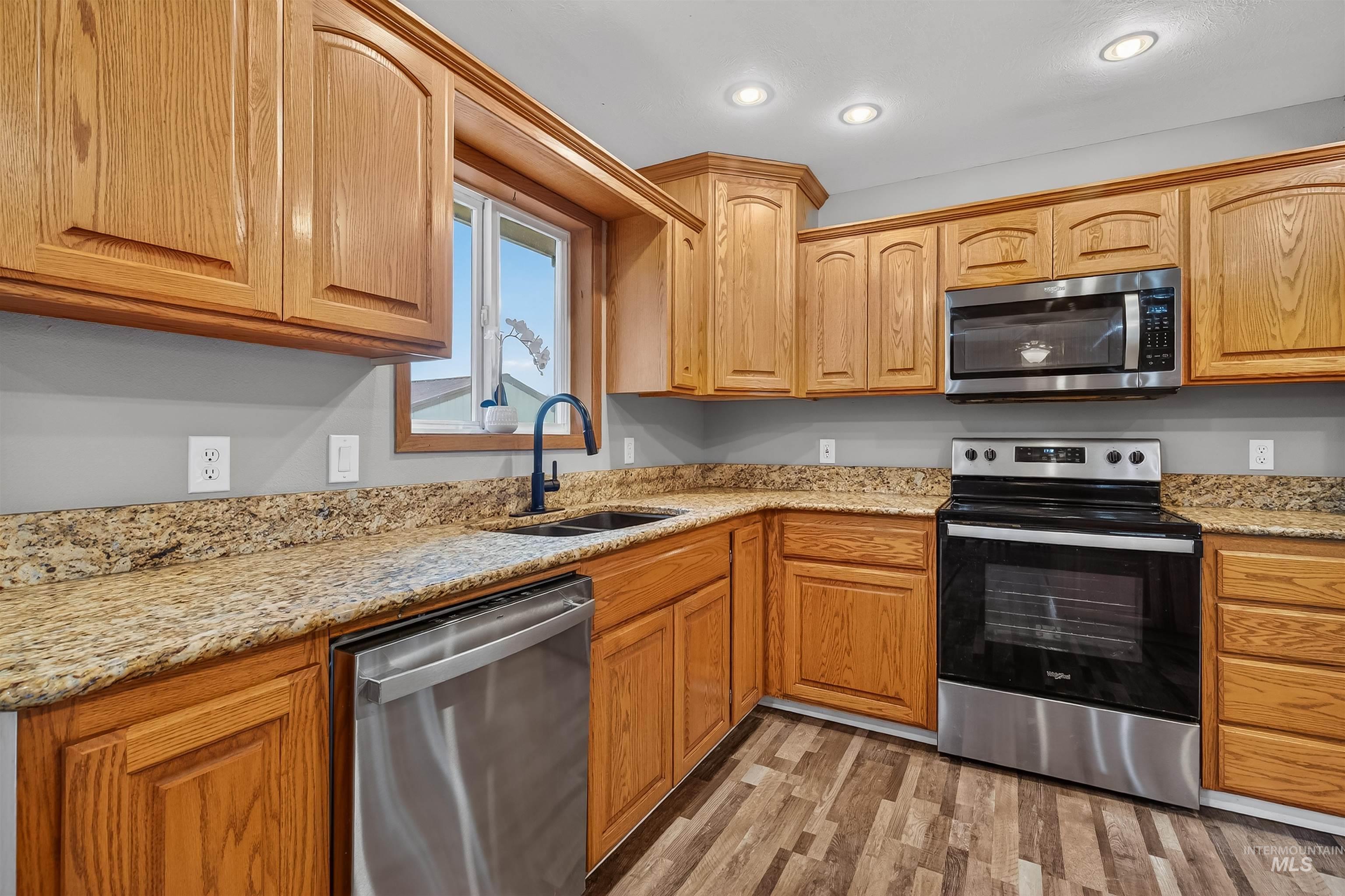 3725 11th Street Lewiston, ID 83501 - Photo 11 of 46 Kitchen with stainless steel appliances, light stone countertops, light wood-type flooring, and recessed lighting