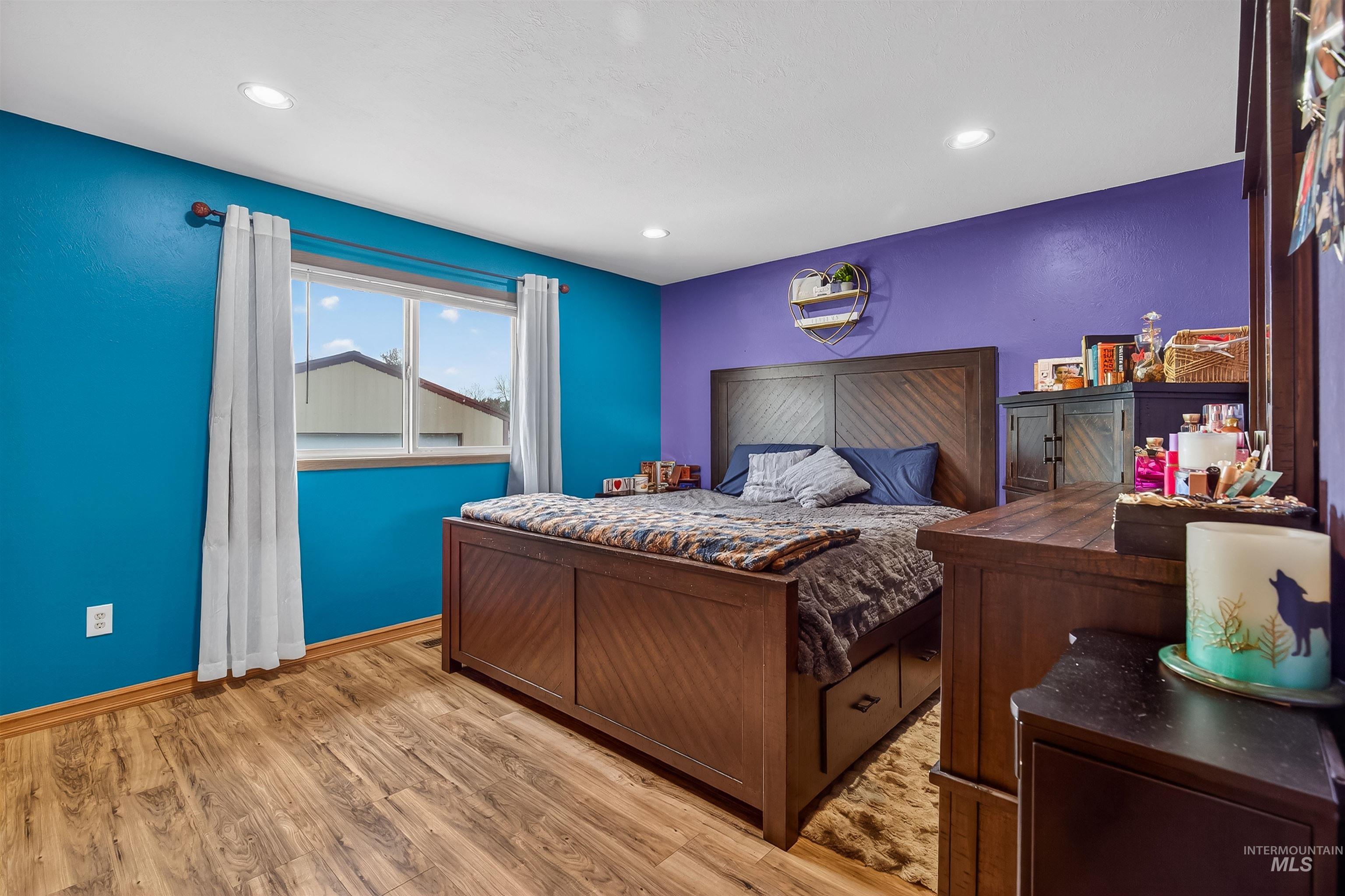 3725 11th Street Lewiston, ID 83501 - Photo 19 of 46 Bedroom featuring light wood-type flooring and baseboards