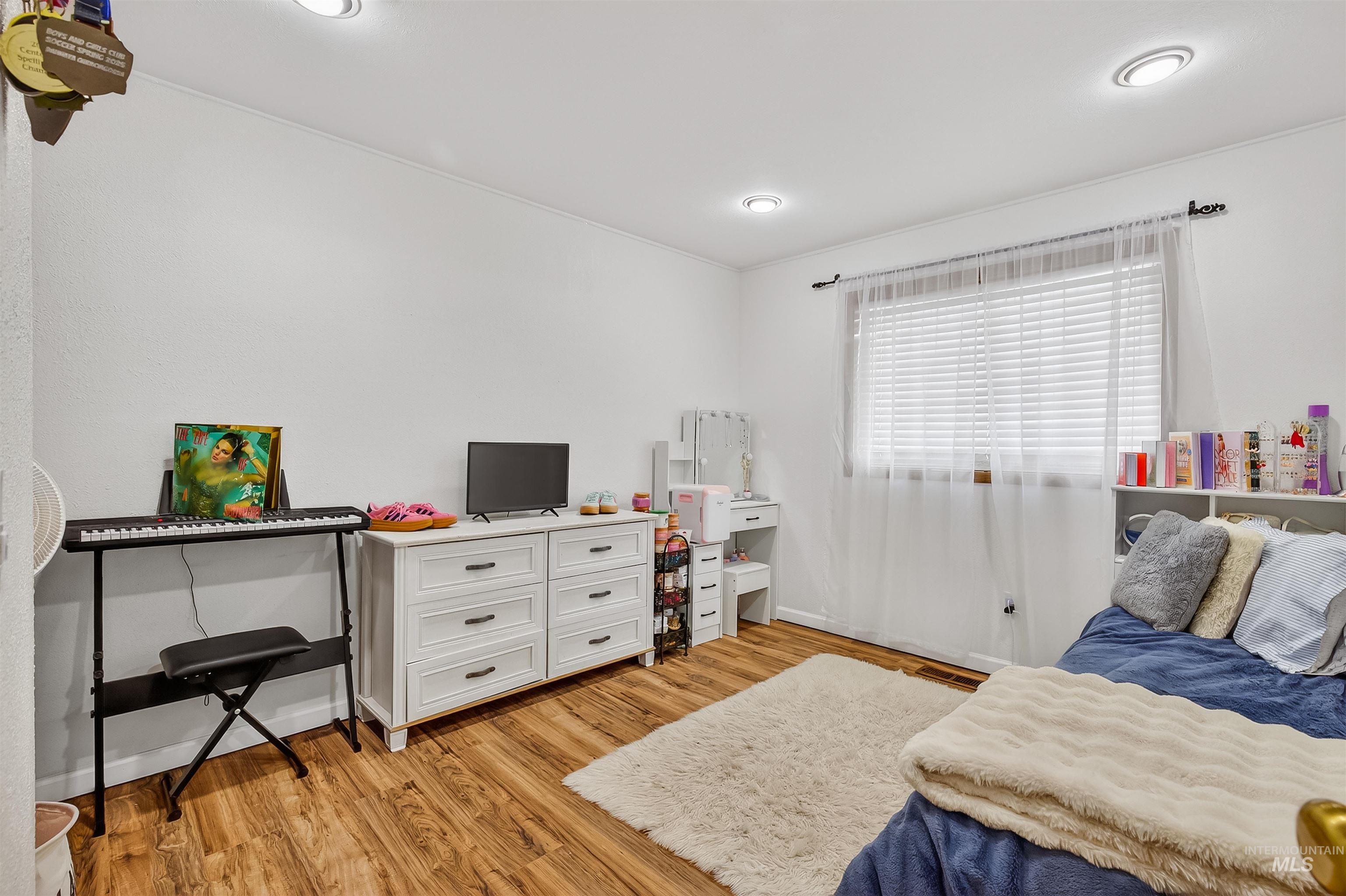 3725 11th Street Lewiston, ID 83501 - Photo 23 of 46 Bedroom with light wood-style floors and baseboards