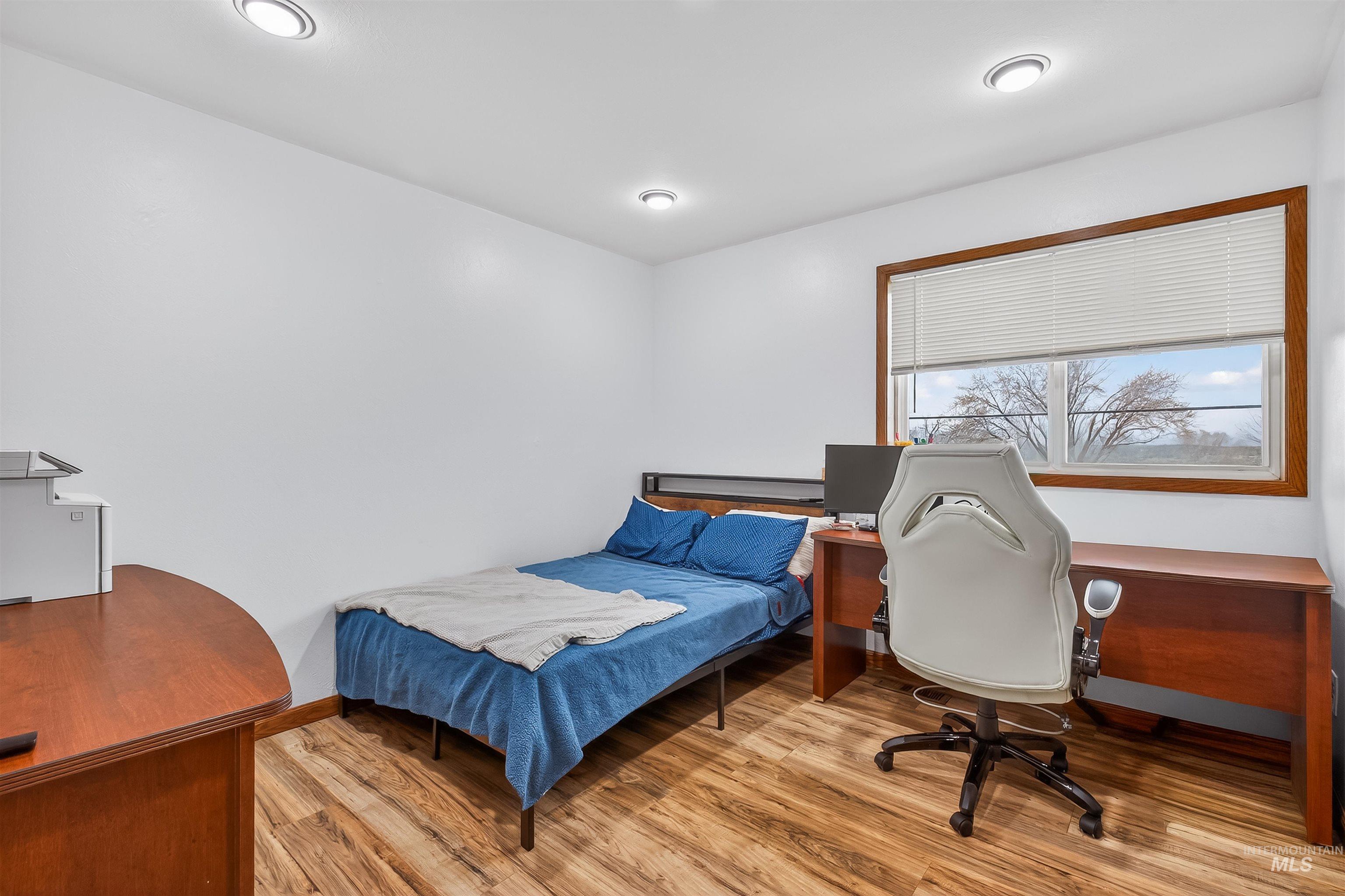3725 11th Street Lewiston, ID 83501 - Photo 25 of 46 Bedroom featuring an office area and light wood-style flooring