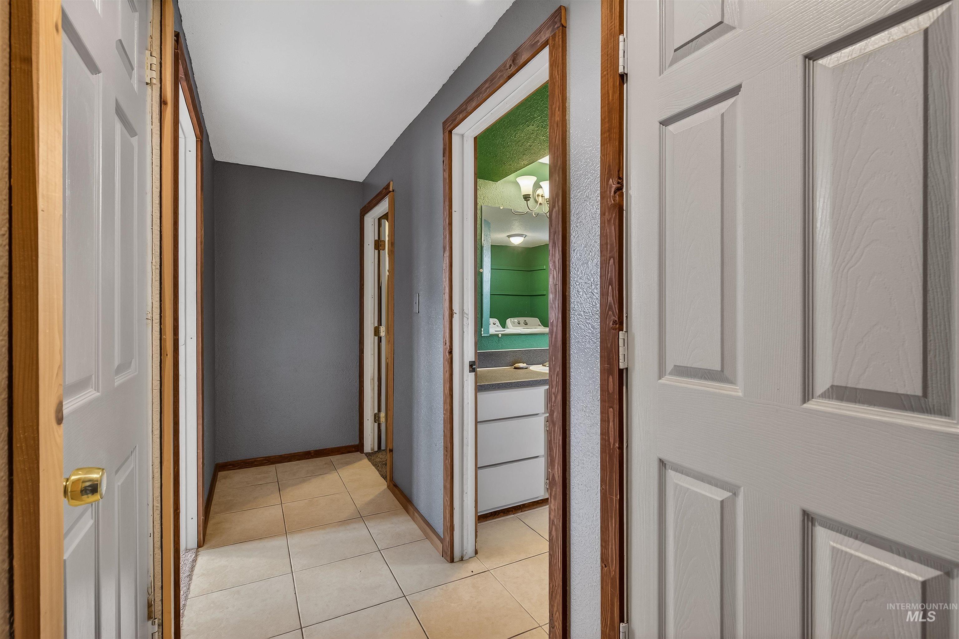 3725 11th Street Lewiston, ID 83501 - Photo 29 of 46 Corridor featuring light tile patterned flooring and baseboards