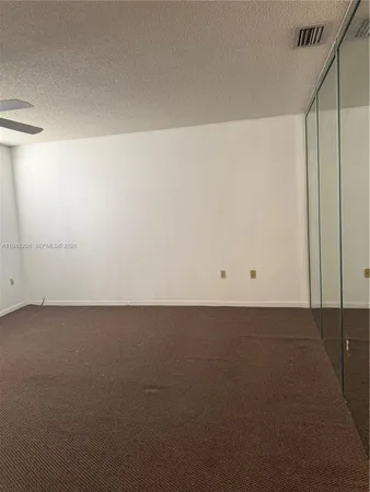 a view of a refrigerator in a room